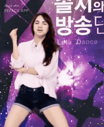 A Woman Is Dancing In Front Of A Purple Sign That Says Let 'S Dance GIF