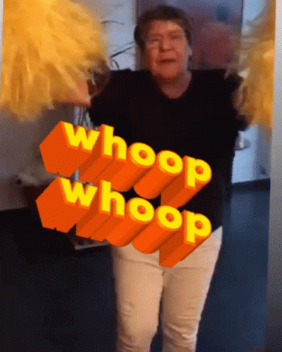 A Woman Is Dancing In Front Of A Sign That Says Whoop GIF