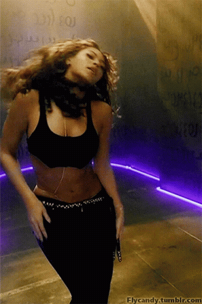 A Woman Is Dancing In Front Of A Wall With The Words Flycandy.tumblr.com On It GIF