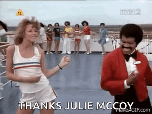 A Woman Is Dancing Next To A Man In A Tuxedo On A Boat . GIF