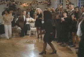 A Woman Is Dancing On A Dance Floor At A Party . GIF