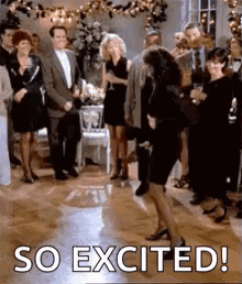 A Woman Is Dancing On A Dance Floor In Front Of A Group Of People At A Party . GIF