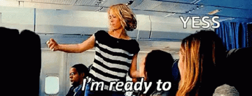 A Woman Is Dancing On An Airplane With The Words I 'M Ready To Yess GIF