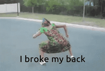 A Woman Is Dancing On The Street With The Words I Broke My Back Written Below Her GIF