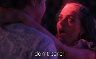 A Woman Is Dancing With A Man And Says I Do N't Care GIF