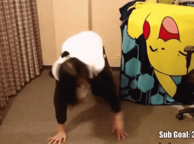 A Woman Is Doing Push Ups In Front Of A Pokemon Blanket That Says Sub Goal GIF