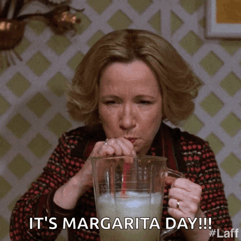 A Woman Is Drinking A Margarita Through A Straw And The Caption Says It 'S Margarita Day GIF