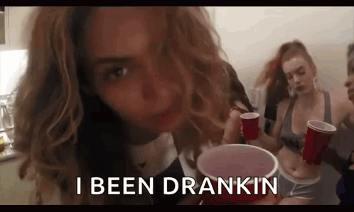 A Woman Is Drinking From A Red Cup And Saying `` I Been Drankin '' . GIF
