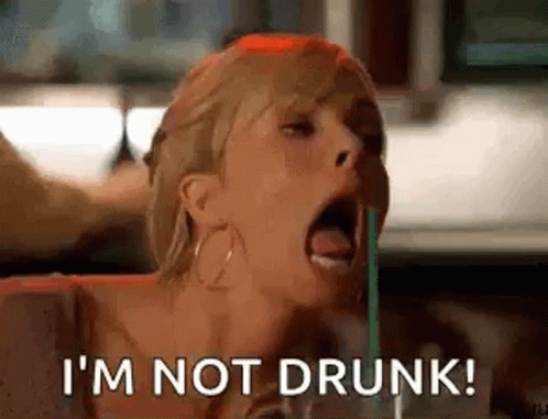 A Woman Is Drinking Through A Straw And Saying I 'M Not Drunk . GIF