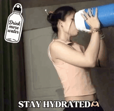 A Woman Is Drinking Water From A Blue Container With The Words " Drink More Water " Written On It GIF
