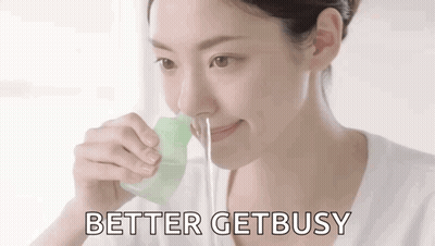 A Woman Is Drinking Water Through A Straw With The Words `` Better Get Busy '' Written Below Her . GIF