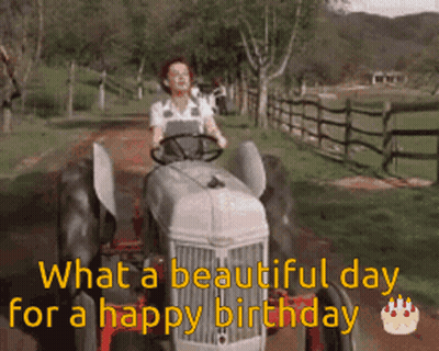 A Woman Is Driving A Tractor Down A Dirt Road With The Words " What A Beautiful Day For A Happy Birthday " GIF