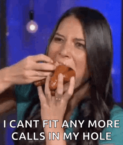 A Woman Is Eating A Donut And Says I Cant Fit Any More Calls In My Hole . GIF