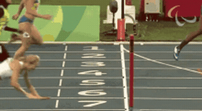 A Woman Is Falling On A Track With The Word Rio On The Side GIF