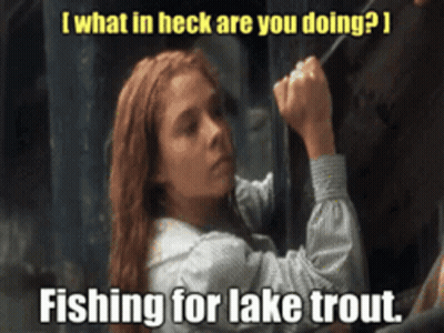 A Woman Is Fishing For A Lake Trout With A Caption That Says " What In Heck Are You Doing " GIF