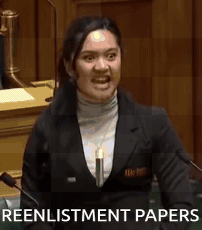 A Woman Is Giving A Speech In A Parliament And Holding A Piece Of Paper In Her Hand . GIF