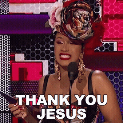 A Woman Is Giving A Speech In Front Of A Microphone And Says Thank You Jesus . GIF