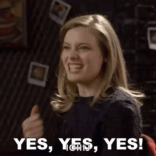 A Woman Is Giving A Thumbs Up And Says Yes , Yes , Yes ! GIF
