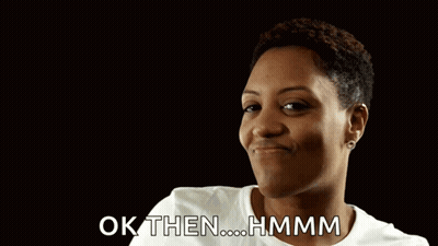 A Woman Is Giving A Thumbs Up With The Words Ok Then Hmmm Behind Her GIF