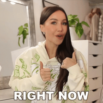 A Woman Is Giving A Thumbs Up With The Words Right Now Written Below Her GIF