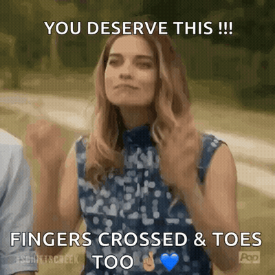 A Woman Is Giving A Thumbs Up With The Words You Deserve This Fingers Crossed & Toes Too GIF