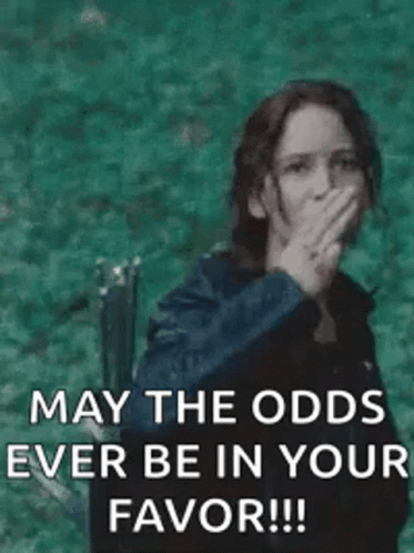 A Woman Is Giving The Middle Finger And Says `` May The Odds Ever Be In Your Favor !! '' GIF