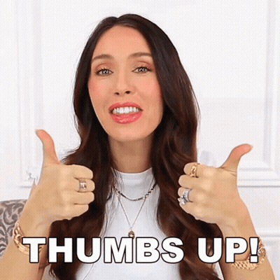 A Woman Is Giving Two Thumbs Up With The Words Thumbs Up Written Above Her GIF