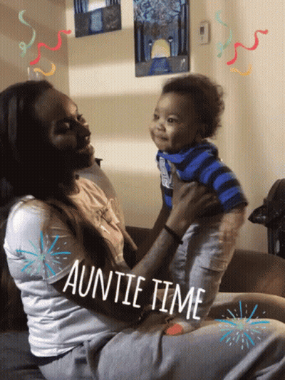 A Woman Is Holding A Baby With The Words Auntie Time Written On The Bottom GIF