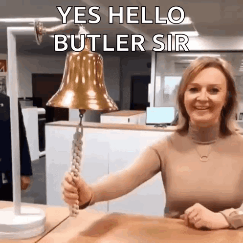 A Woman Is Holding A Bell With The Words Yes Hello Butler Sir On It GIF