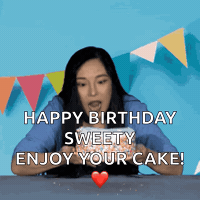 A Woman Is Holding A Birthday Cake With The Words Happy Birthday Sweety Enjoy Your Cake GIF