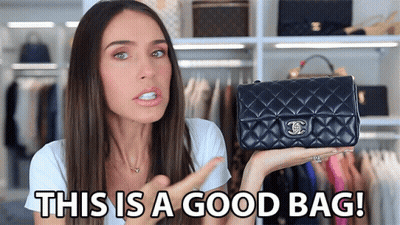 A Woman Is Holding A Black Chanel Purse And Says " This Is A Good Bag " GIF