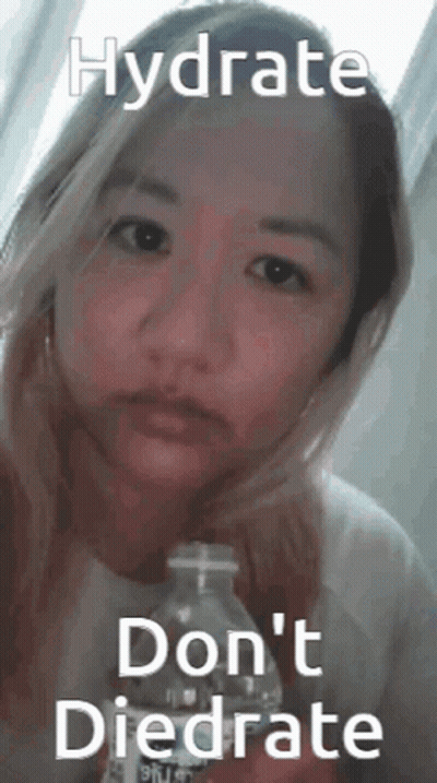 A Woman Is Holding A Bottle Of Water With A Caption That Says Hydrate Don 'T Diedrate . GIF