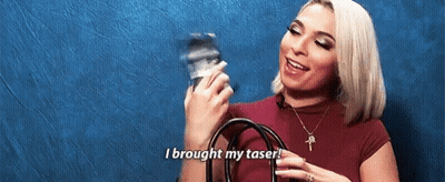 A Woman Is Holding A Camera And Saying `` I Brought My Taser ! '' GIF