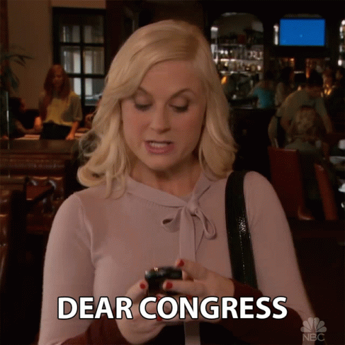 A Woman Is Holding A Cell Phone And Says Dear Congress On The Screen GIF