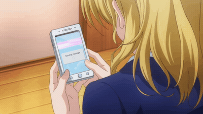 A Woman Is Holding A Cell Phone That Says Sending Message On The Screen GIF