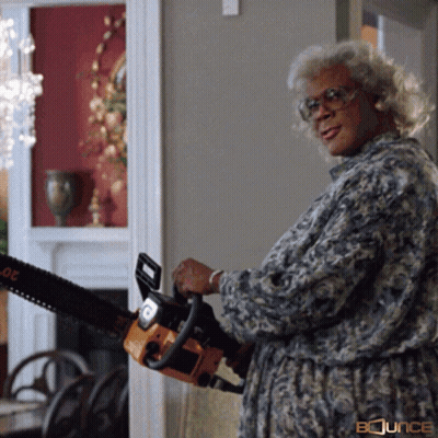 A Woman Is Holding A Chainsaw With Bounce Written On The Bottom GIF