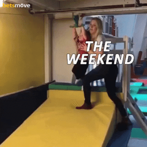 A Woman Is Holding A Child On A Monkey Bars And The Words The Weekend Are Above Them GIF