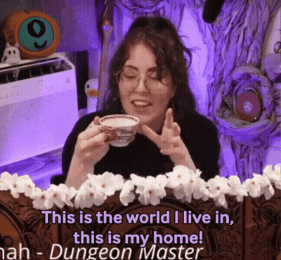 A Woman Is Holding A Cup Of Coffee And Says " This Is The World I Live In This Is My Home ! " GIF