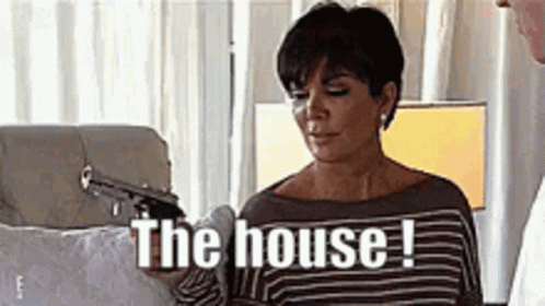 A Woman Is Holding A Gun In Her Hand And Says `` The House ! '' GIF