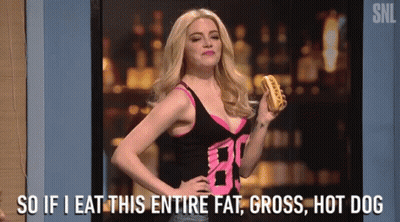 A Woman Is Holding A Hot Dog And Saying `` So If I Eat This Entire Fat , Gross , Hot Dog '' GIF