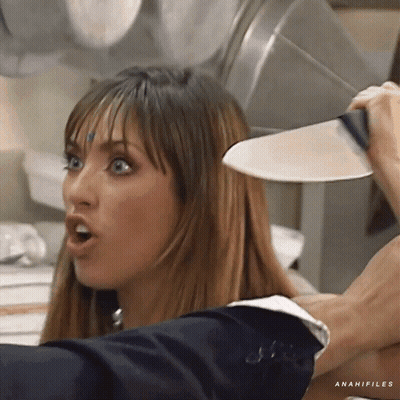 A Woman Is Holding A Knife Over Her Head And The Word Anahifiles Is On The Bottom GIF