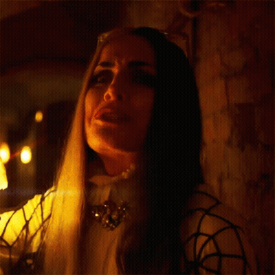 A Woman Is Holding A Lantern And Says So Manly Y! GIF