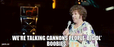 A Woman Is Holding A Microphone And Saying We 'Re Talking Cannons People Big Ol Boobies GIF