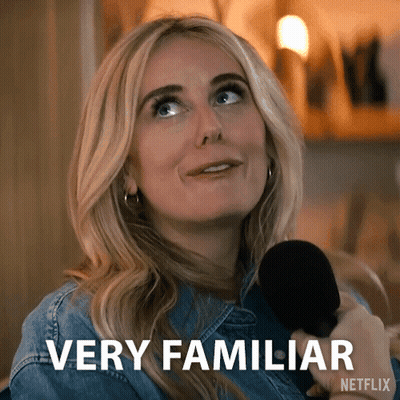 A Woman Is Holding A Microphone And Says Very Familiar On The Screen GIF