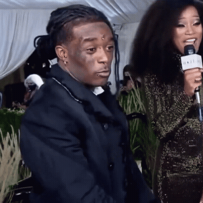 A Woman Is Holding A Microphone That Says ' N.i.i.i.i. ' On It GIF