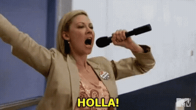 A Woman Is Holding A Microphone With Her Mouth Open And Screaming . GIF
