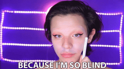 A Woman Is Holding A Pencil In Front Of Her Face With The Words Because I 'M So Blind Below Her GIF