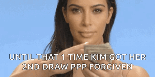 A Woman Is Holding A Piece Of Paper That Says Until That Time Kim Got Her 2Nd Draw Ppp Forgiven GIF