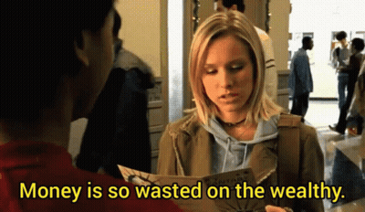 A Woman Is Holding A Piece Of Paper With The Words Money Is So Wasted On The Wealthy GIF