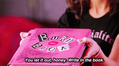 A Woman Is Holding A Pink Burn Book In Her Hands And Saying `` You Let It Out , Honey . Write In The Book . '' GIF